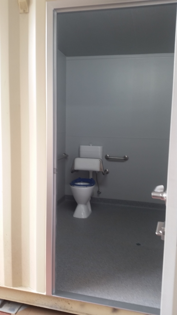 20' as new container modified into 3 toilet cubicles; disabled, ambulant and standard with a storeroom behind the container doors
