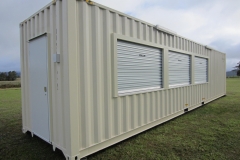 40' as new high cube container modified with 4x roller doors, benches under the three serving roller doors, 1x PA door, laundry tub, pressure pump, vinyl floor coverings and electrical fit out.
