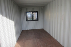 20' container modified with a glass sliding door and glass window